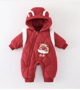 Detail of red quilted baby winter romper with dragon embroidery and fuzzy ears