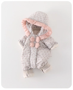 Detail of floral baby winter romper with pink ruffle hood and 3D bow accents