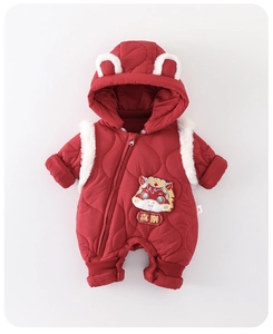 Detail of red quilted baby romper featuring dragon embroidery and cute plush ears hood