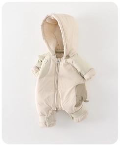 Detail of hooded baby winter romper with white duck down filling and soft ribbed cuffs