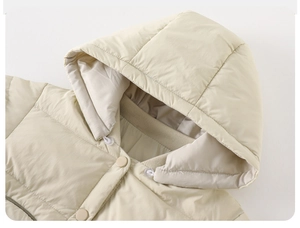 Detail of hooded down puffer jacket with matte snap buttons and ribbed windproof collar