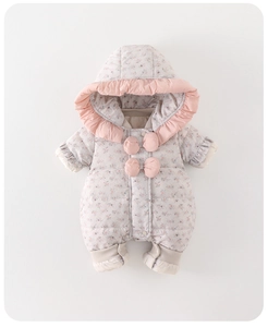 Detail of floral baby down romper featuring a pink ruffled hood and decorative bow