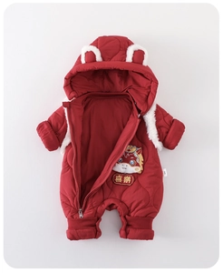 Detail of red quilted baby romper featuring festive embroidery and cute hooded ears