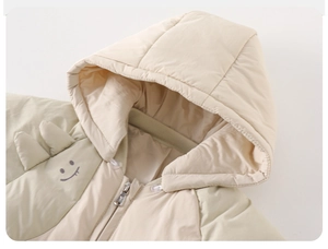 Detail of baby down romper with hood, showing zipper protection and cute smile face embroidery