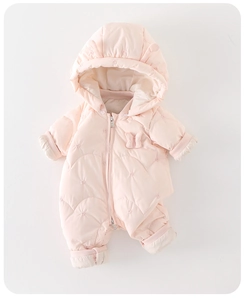 Detail of pink quilted snowsuit featuring floral embroidery and front bow accent
