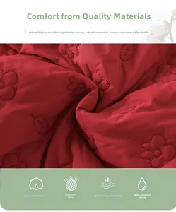 Detail of red quilted fabric with floral stitching, soft and breathable baby winter cotton
