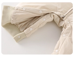 Detail of baby winter jumpsuit showing secure snap buttons and smooth metal zipper