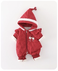 Detail of red padded baby romper with floral quilting, ruffled shoulders and faux fur trim