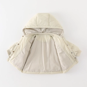 Lightweight toddler puffer jacket in cream white featuring hood and snap button details