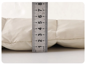 Close-up measurement showing the 3.5cm thickness of the warm baby down jumpsuit