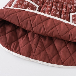 Quilted floral baby girl winter dress in brick red with warm padding and white trim