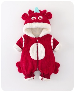 Close-up of baby romper with dragon horns, red fleece texture, and zipper detail