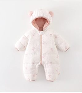 Detail view of pink baby winter romper with cute ear hood and bunny floral patterns