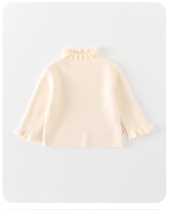 Detail of baby cream knit sweater with elegant ruffle collar and ribbed texture fabric