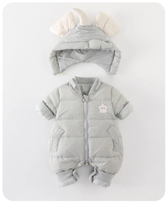 Detailed close-up of quilted gray baby winter romper with unicorn embroidery and ear hat
