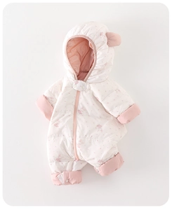 Close-up of white baby down romper featuring cute pink bunny patterns and soft hood ears