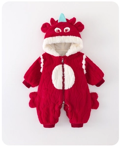 Detail of red fleece baby bodysuit with cartoon dragon hood and white chest patch