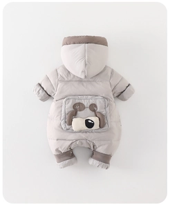 Detail of baby winter down jumpsuit featuring cartoon dog design and ribbed cuffs
