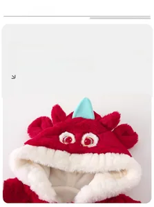 Macro detail of red plush baby jumpsuit with monster horn embroidery and fleece lining