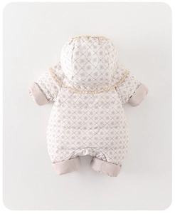 Close-up of baby floral snowsuit with diamond quilting and delicate lace trim detail
