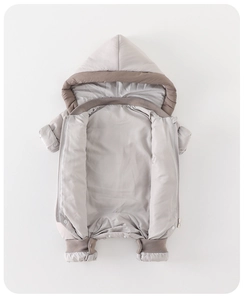 Close-up of windproof ribbed cuffs and zipper detail on baby winter hooded down romper