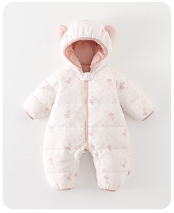 Close-up of baby romper with pink rabbit patterns, hood ears, and front zipper detail