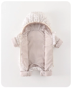 Detail of floral baby winter romper featuring lace hood trim and warm padded lining