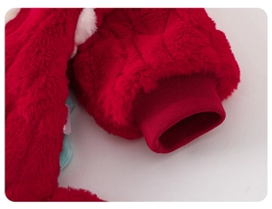 Detail of red plush baby romper with soft faux fur fabric and knitted ribbed windproof cuffs