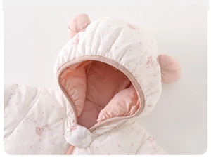 Detail of baby winter jumpsuit with cute rabbit print and 3D animal ears on hood