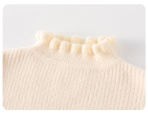 Close-up of elegant ruffled high collar on a beige knitted sweater with ribbed texture