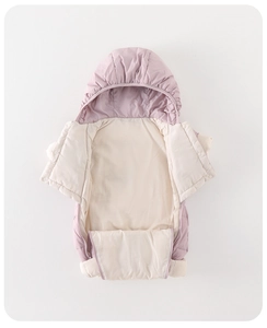Detail of lavender baby down romper with wavy quilting and soft white inner lining