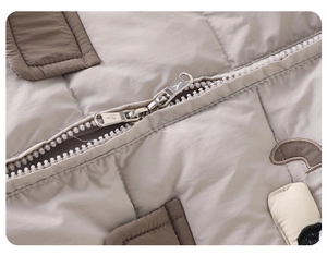 Close-up of baby winter down romper showing the durable two-way metal zipper and quilted fabric