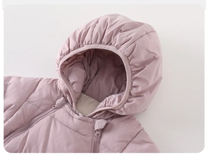 Detail view of pink baby down jumpsuit with quilted waterproof fabric and zipper