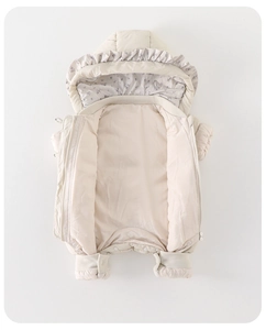 Detail showing the inner purple floral lining and ruffle trim on this baby down jumpsuit