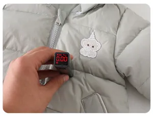 Close-up of baby romper fabric testing showing zero fluorescent agents for safety