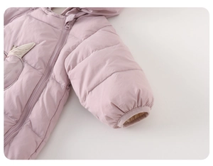Detail of pink quilted baby down jacket showing the smooth zipper and elastic cuffs