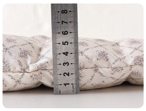 Close-up of baby winter romper padding showing 5cm thickness for thermal insulation