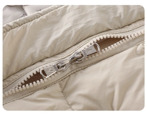 Detail view of the durable double-way metal zipper on the warm baby down jumpsuit