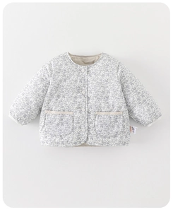 Detailed view of the floral quilted cotton coat featuring a round collar and white buttons
