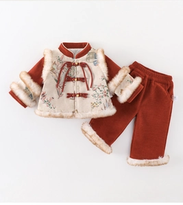 Detailed view of baby girl's winter traditional Tang suit with thick padding and fur trim