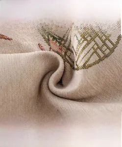 Macro view showing high-density woven fabric texture with intricate gold geometric patterns