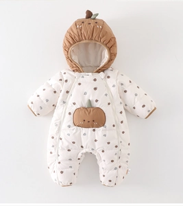Detail of baby quilted winter romper with pumpkin print and dual zipper closure