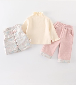 Detailed view of 3-piece baby girl winter outfit with floral vest and knit sweater