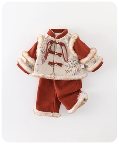 Detail of traditional Chinese New Year outfit with embroidered vest and corduroy pants