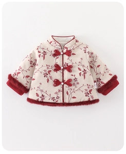 Detailed view of white floral baby winter suit with red faux fur trim and pearl buttons