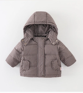 Detail of baby winter padded jacket featuring brown checkered pattern and hood design