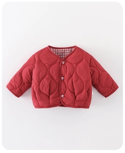 Detail of red quilted winter jacket featuring plaid buttons and wave stitching