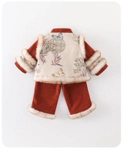 Detail of baby girl traditional winter Tang suit with warm embroidery and fur trim