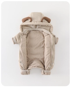 Detail of baby winter jumpsuit with cute ram horns on hood and dual zipper closure