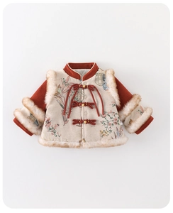 Detailed macro view of embroidered floral fabric and traditional red Chinese knot buttons